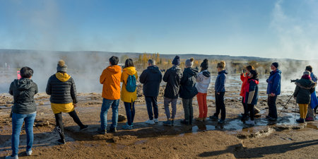 Tourists at hot spring, Geysir, Namafjallï¿½Hverir Geothermal Area, Blaskogabyggd, Southern Region, Icelandのeditorial素材