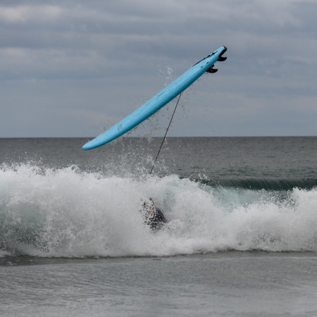Surfer caught in a wave in the ocean, Hot Water Beach, Coromandel Peninsula, North Island, New...