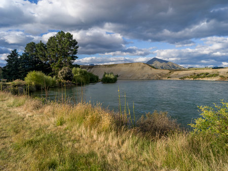Lake with mountain range in the background, Albert Town, Wanaka, Otago Region, South Island, New Zealandのeditorial素材