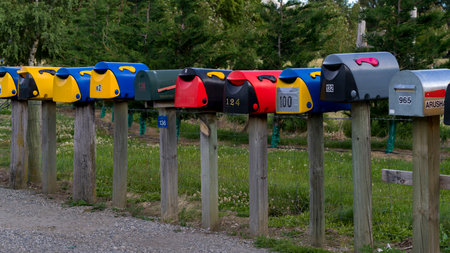 Letter boxes on poles in a row, Albert Town, Wanaka, Otago Region, South Island, New Zealandのeditorial素材