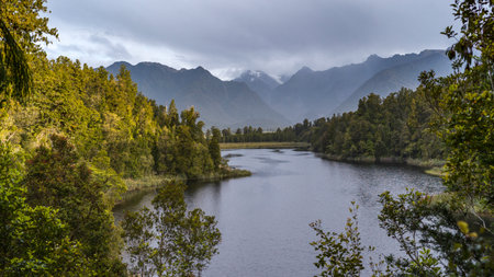Lake with mountain range in the background, Lake Matheson, West Coast, South Island, New Zealandのeditorial素材