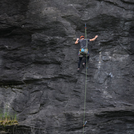Man rock climbing, Diamond Lake Conservation Area, Wanaka, Otago Region, South Island, New Zealandのeditorial素材
