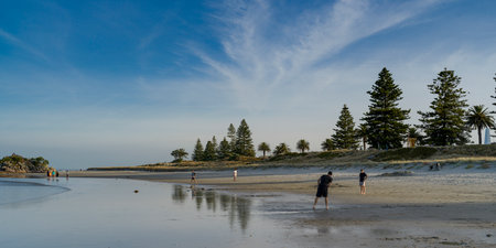 Tourists on beach, Mount Maunganui, Bay of Plenty, North Island, New Zealandのeditorial素材