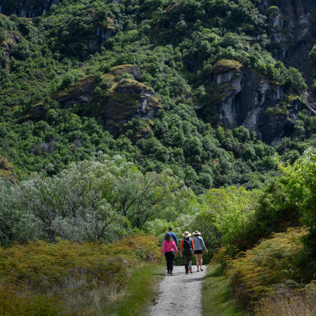 Tourists walking on dirt road, Diamond Lake Conservation Area, Diamond Lake, Lake Wanaka, South Island, New Zealandのeditorial素材
