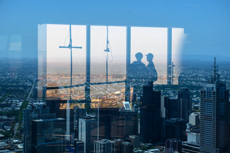 Silhouette of tourist looking at city from Eureka Tower, Melbourne, State Of Victoria, Australiaのeditorial素材