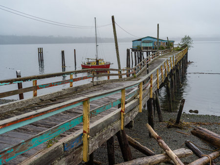 Dock along the shoreline Village of Alert Bay on Cormorant Island, Johnstone Strait, British Columbia, Vancouver Island, Canadaのeditorial素材