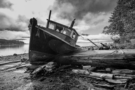 Boat stranded ashore on Alert Bay, Cormorant Island, Johnstone Strait, Vancouver Island, British Columbia, Canadaのeditorial素材