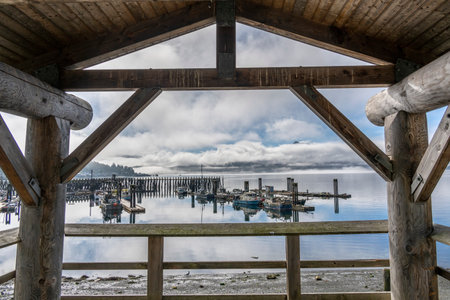 Covered dock along the shoreline of Alert Bay on Cormorant Island, Johnstone Strait, British Columbia, Vancouver Island, Canadaのeditorial素材