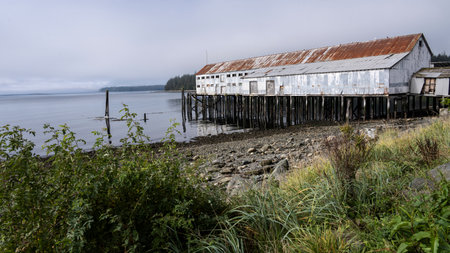 Dilapidated building on a pier along shoreline of Alert Bay, Cormorant Island, Johnstone Strait, Vancouver Island, British Columbia, Canadaのeditorial素材