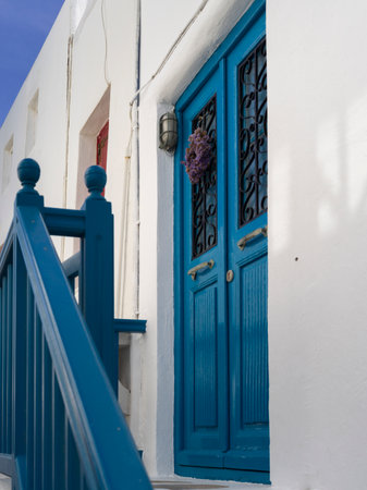 Exterior blue door at the top of a staircase in Mykonos Town, Mykonos Island, Greeceのeditorial素材