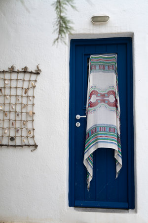 Cloth hung on n exterior door, Agios Sostis Beach, Mykonos Greeceのeditorial素材