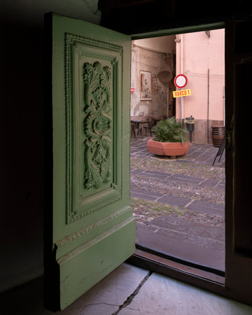 Carved open door in the town of Bosa which is situated about two-thirds of the way up the west coast of Sardinia, Italyのeditorial素材