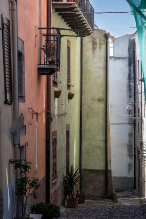 Buldings along a street in the town of  Bosa which  is situated about two-thirds of the way up the west coast of Sardinia, Italyのeditorial素材