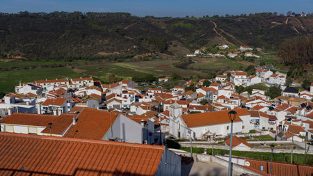 Overview of buildings in the village Odeceixe, that lies on the south bank of the Ribeira de Seixe, which here forms the border between the Algarve and Alentejo, Odeceixe, Faro, Portugalのeditorial素材