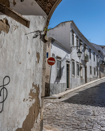 Cobblestone narrow rode in Faro that is the capital of southern Portugalâ€™s Algarve region....
