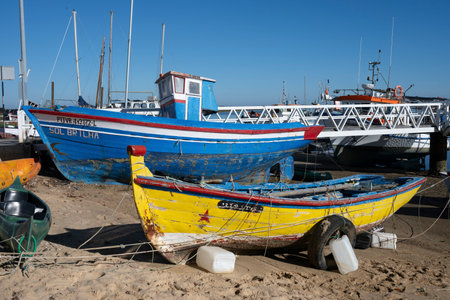 Boats docked along the shoreline  in Santa Luzia Tavira that is considered the capital do Polvo or...