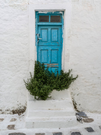 Blue door on the exterior of a building in Mykonos Town, Mykonos Island, Greeceのeditorial素材