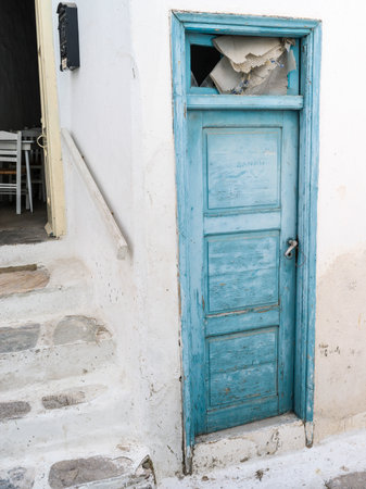 Blue door on the exterior of a building in Mykonos Town, Mykonos Island, Greeceのeditorial素材