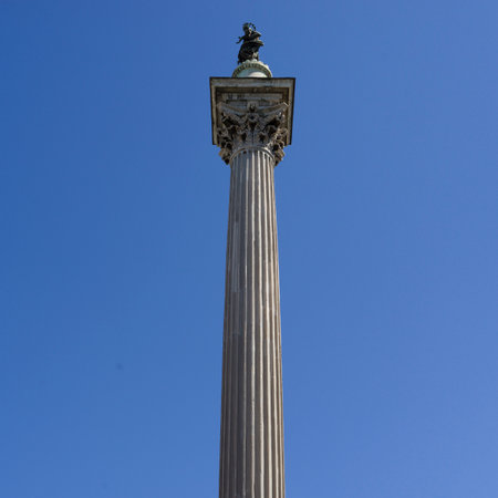 Upward view of a statue at the top of a pedestal at the former center of Ancient Rome, Italyのeditorial素材
