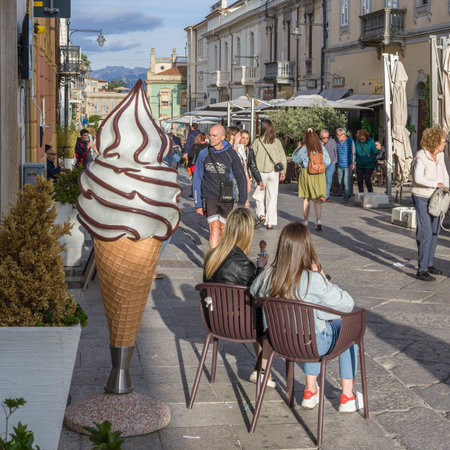 Street view of  pedestrians in the coastal city of Olbia in northeast Sardinia, Italyのeditorial素材