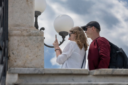 Two tourists standing outside a building, Bastione di Saint Remy, Cagliari, Sardinia, Italyのeditorial素材