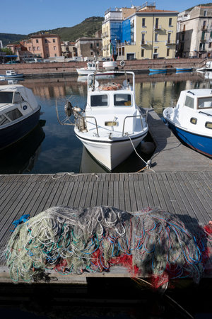 Boats along the pier in the town of Bosa which is situated about two-thirds of the way up the west...