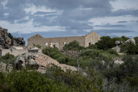Derelict building amongst the landscape of Bear Rock, Roccia dell'Orso, Sassari, Palau, Sardinia, Italyのeditorial素材