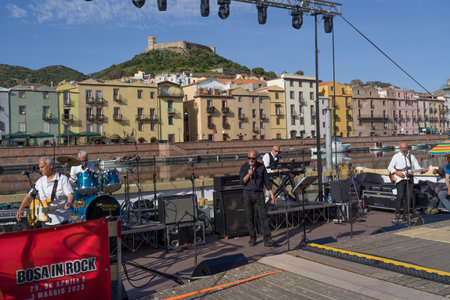 Group of musicians with their instruments set up on the street of Bosa, Sardinia, Italyのeditorial素材