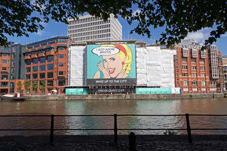 Bristol, UK - June 10, 2015: A hoarding advertising a new housing development with the slogans...
