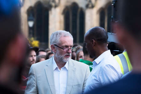 Bristol, UK - August 8, 2016: Jeremy Corbyn MP speaks to a member of the audience at a rally during...