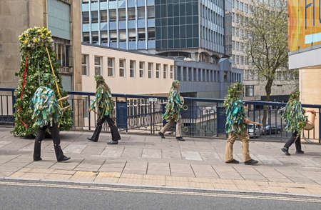 Bristol, UK - May 7, 2016: Jack in the Green and his attendants parade through the city streets to...
