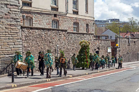 Bristol, UK - May 4, 2013: Jack in the Green and his attendants parade through the city streets to...