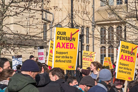 Bristol, UK - February 22, 2018: Striking university staff and their supporters protest about proposed changes to their pension scheme outside the University of Bristolâs Wills Memorial Buildingのeditorial素材