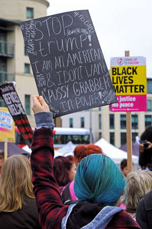 Bristol, UK - November 12, 2016: A woman holds a placard aloft at a demonstration against the election of Donald Trump as US presidentのeditorial素材