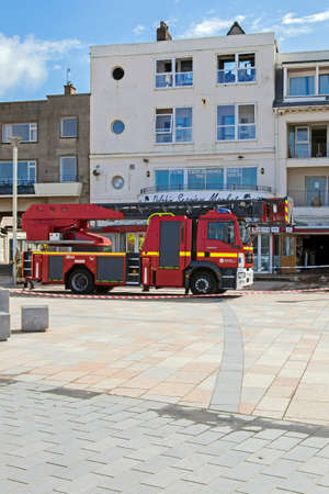 Weston-super-Mare, UK - April 29, 2015: Firefighters and police officers attend a fire on the sea frontのeditorial素材