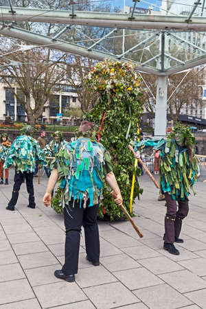 Bristol, UK - May 4, 2013: Jack in the Green and his attendants parade through the city streets to...