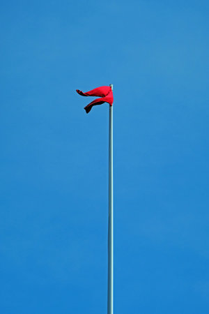 Bristol, UK - May 8, 2018: A pair of red trousers fly from a flagpole near City Hall. Mayor George...