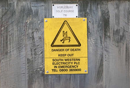 Weston-super-Mare, UK - February 8, 2021: A sign warning of danger of death on the door of an electricity substationのeditorial素材