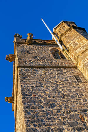 Worle, UK - January 12, 2022: The tower of St Martinâs church in Worle, UK illuminated by the setting sun.のeditorial素材