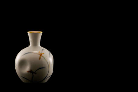 japanese porcelain sake bottle on a black backgroundの写真素材