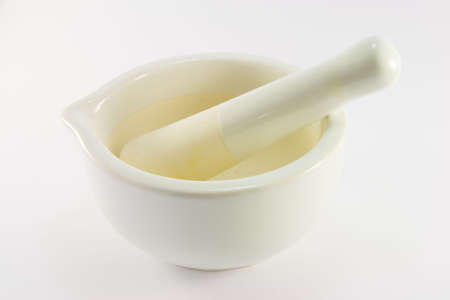 White stone mortar and pestle on a white backgroundの写真素材