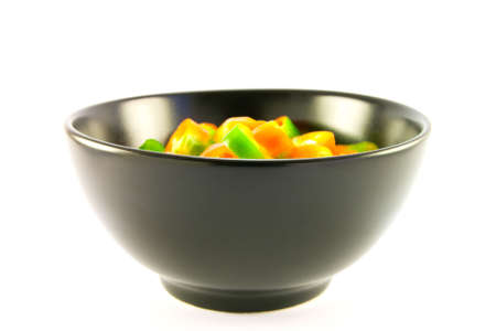 Chopped chillis in a black bowlの写真素材