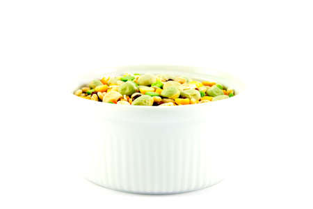 Assorted soup pulses in a small round dish with a white backgroundの写真素材