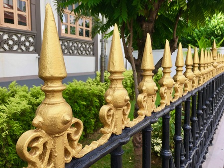 Iron Fence top details with painted golden spikesの写真素材