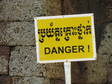 Danger word sign in english and Cambodian Khmer
