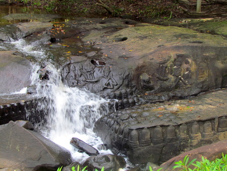 Riverbed and watterfall carving at Kbal Spean Khmer relics in Angkor temple area in Cambodiaの写真素材