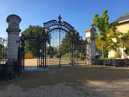Main entrance cast iron gate of Jardin des Serres dAuteuil botanical garden in Bois de Boulogne...