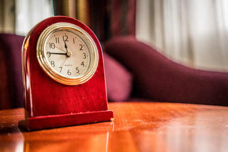 Old Fashioned wooden clock in boudoir vintage style ambiance - Time pass concept