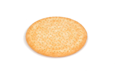 Single Round Generic snack cracker biscuit isolated on white backgroundの写真素材