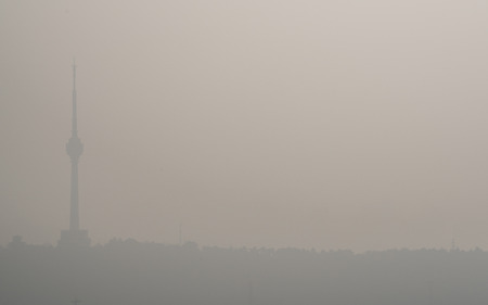 Sunrise on pollution peak day in Wuhan central China with visible dirty haze in the air with view of tortoise mountainの写真素材